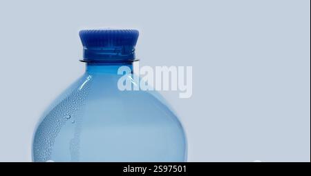 A blue plastic PET water bottle close up isolated on white background. Recycling, environment friendly and ecology concept. Stock Photo