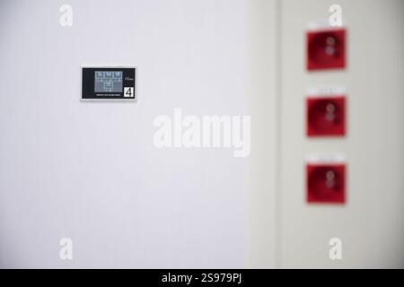 Medical Alarm Panel and Electrical Outlets on a White Wall Stock Photo