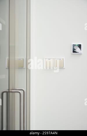 Modern touchless automatic door openers and door details Stock Photo