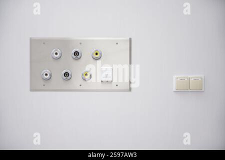 Medical Gas Outlets, and Switches on a White Wall Stock Photo