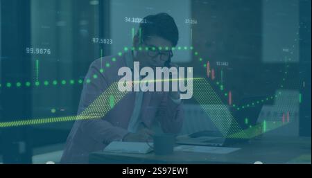 Analyzing financial data and talking on phone, businessperson over stock market image Stock Photo