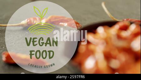 Vegan food locally grown image over blurred image of dried chili peppers Stock Photo
