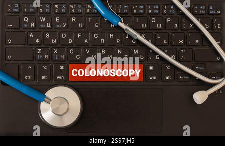Tablet with the text Colonoscopy on the display. Stock Photo