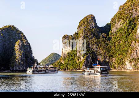 Tourist boats sail though Ha Long Bay, Vietnam, Saturday, November 02, 2024. Photo: David Rowland / One-Image.com Stock Photo