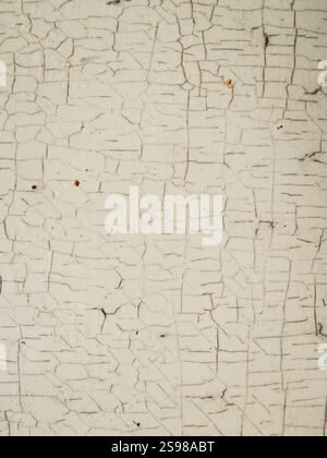 Close-Up of Cracked and Peeling White Paint Stock Photo