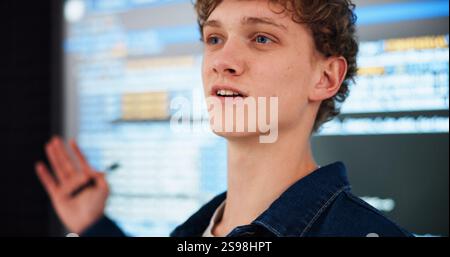 Programming lecture, student and man in college for learning, education or teaching ai course. University, class and study coding with data for Stock Photo