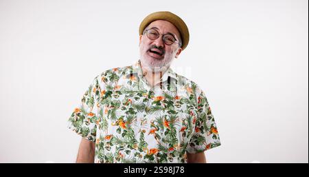 Portrait, fashion and senior man laugh with glasses, retro style or retirement on white studio background. Face, funny or elderly person with eyewear Stock Photo