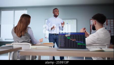 Teacher In Classroom Lesson. High School Education Stock Photo