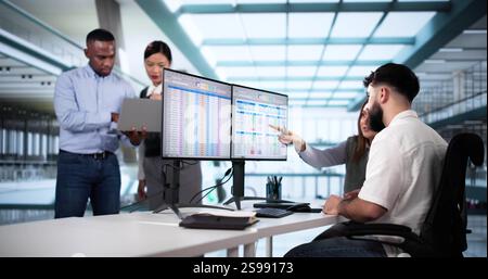 People Working With Spreadsheet Data On Computer Monitor Stock Photo