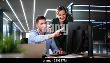 Business Data Analysts Man And Woman Using Computer Stock Photo