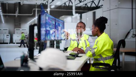 Engineer Operators Using Scada System At Industrial Plant Stock Photo