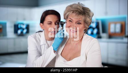 Otolaryngology Ear Check Using Otoscope. Doctor Examining Patient Stock Photo
