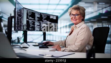 Software Programmer Or Coder Woman Using Office Computer Stock Photo