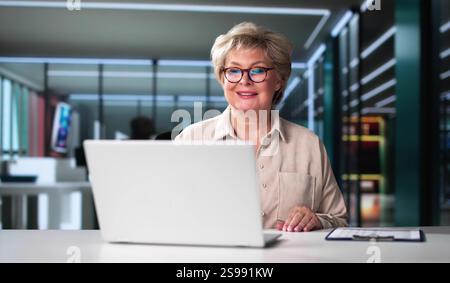 Watching Online Video Conference Meeting In Office Stock Photo