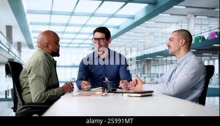 Multicultural Business Team Collaborating in Office Boardroom Meeting Discussion Stock Photo