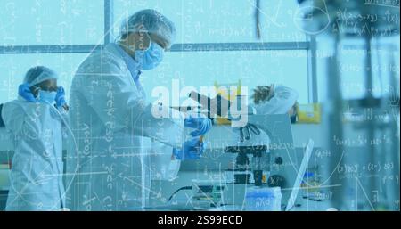 Scientists working with microscopes, mathematical equations image over laboratory scene Stock Photo
