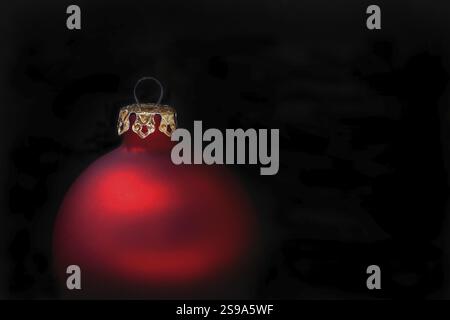 Red Christmas baubles on a black background Stock Photo