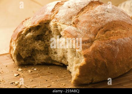 Close-up of a partially eaten bread roll or loaf of bread Stock Photo
