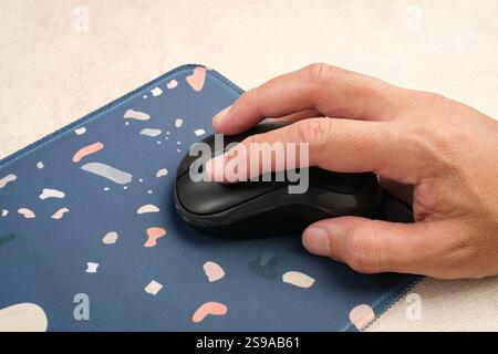 Hand using wireless computer mouse Stock Photo