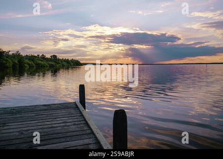 Beautiful romantic colourful sunset over a calm lake Stock Photo