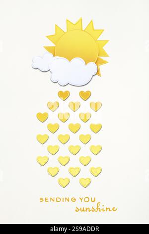 Creative valentines concept photo of sun with clouds and hearts made of paper on grey background Stock Photo