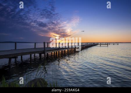 Beautiful romantic colourful sunset over a calm lake Stock Photo