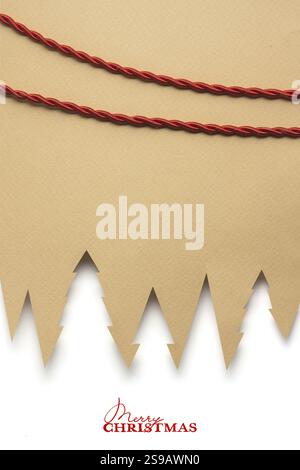 Creative concept photo of paper Christmas trees on a brown background Stock Photo