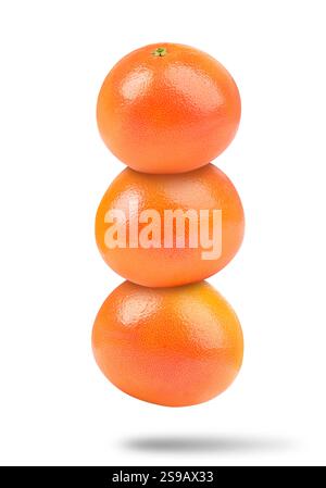 Fresh grapefruits in air on white background Stock Photo