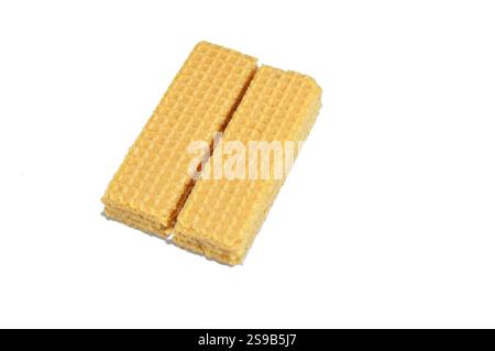 layers of wafer biscuits filled with creamy vanilla, a wafer is a crisp, sweet, very thin, flat, light biscuit,  creamy vanilla sandwiched in wafers, Stock Photo