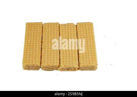 layers of wafer biscuits filled with creamy vanilla, a wafer is a crisp, sweet, very thin, flat, light biscuit,  creamy vanilla sandwiched in wafers, Stock Photo
