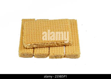 layers of wafer biscuits filled with creamy vanilla, a wafer is a crisp, sweet, very thin, flat, light biscuit,  creamy vanilla sandwiched in wafers, Stock Photo