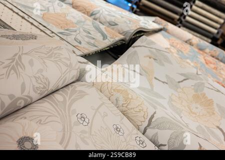 Rolls of wallpaper on a table Stock Photo