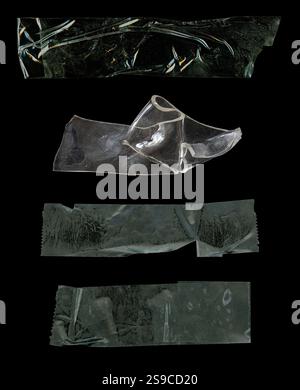 Transparent tape strips collection isolated on black background. Crumpled wrinkled sticky tape for overlays photo and paper fixture. Stock Photo