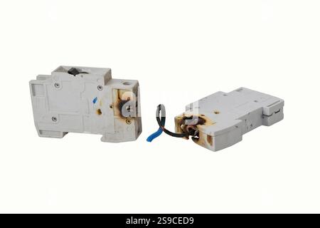 Burned electrical circuit breaker, fuse box on white background.  The burned cable Stock Photo