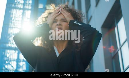 Sick ill unhealthy stressed business woman bad feeling headache migraine Caucasian businesswoman massaging painful head tired office manager outdoors Stock Photo