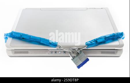 A laptop tightly secured with a blue-wrapped chain and a silver padlock highlights the concept of digital security and protection against threats. Use Stock Photo