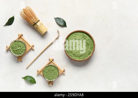 Composition with powdered matcha tea and accessories on light background Stock Photo