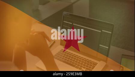 Person working on laptop with coding image over flag of french guiana Stock Photo