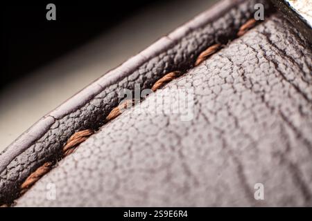 Detailed view of brown textured fabric highlighting elegant stitching design for vintage aesthetics Stock Photo