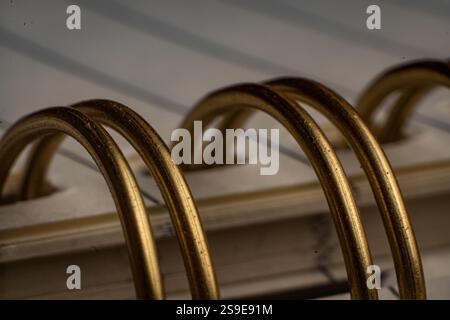 Close-up of spiral binding showcasing intricate details in an office notebook Stock Photo