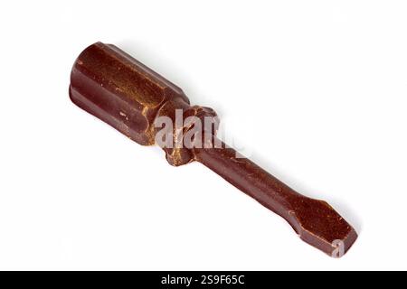 Old rusty screwdriver isolated on white background. Close-up. Stock Photo