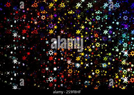 Colorful Stars on a Dark Background Texture,  vibrant and detailed texture featuring multicolored stars scattered across a dark background. The stars Stock Photo