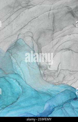 Alcohol ink abstract art showcasing fluid hues in blue and gray tones Stock Photo