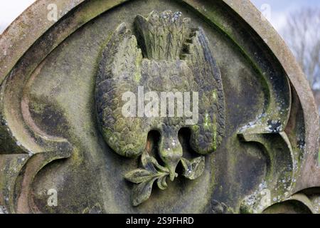 Victorian gravestone with dove carving at Blackburn Cemetery. Stock Photo