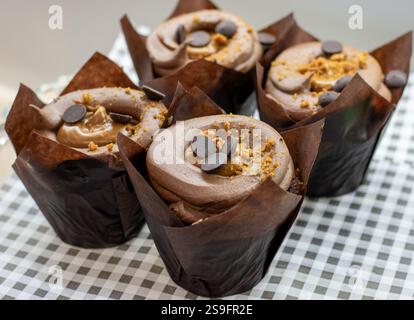 Easy and delicious vegan Biscoff cupcakes with a delicious hidden Biscoff centre, and Biscoff vegan buttercream Stock Photo