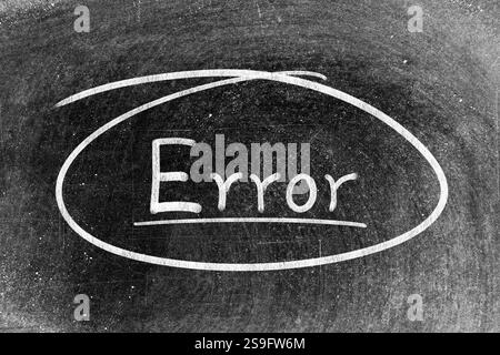 White chalk hand writing in word error and circle shape on blackboard background Stock Photo