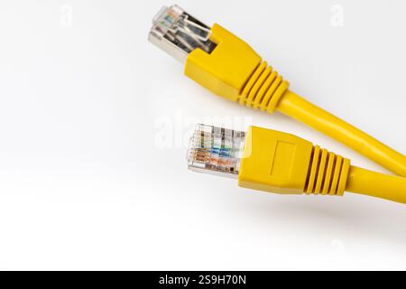 Ethernet cable isolated on white background. LAN network, data transfer speed and internet connection concept. Stock Photo