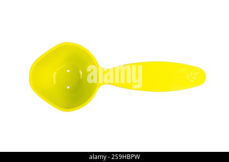 Green measuring spoon isolated on white background. Stock Photo