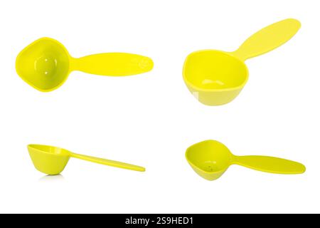 Green measuring spoon isolated on white background. Stock Photo