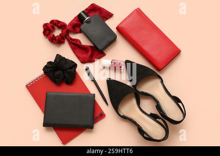 Composition with stylish female accessories, shoes and notebooks on color background Stock Photo